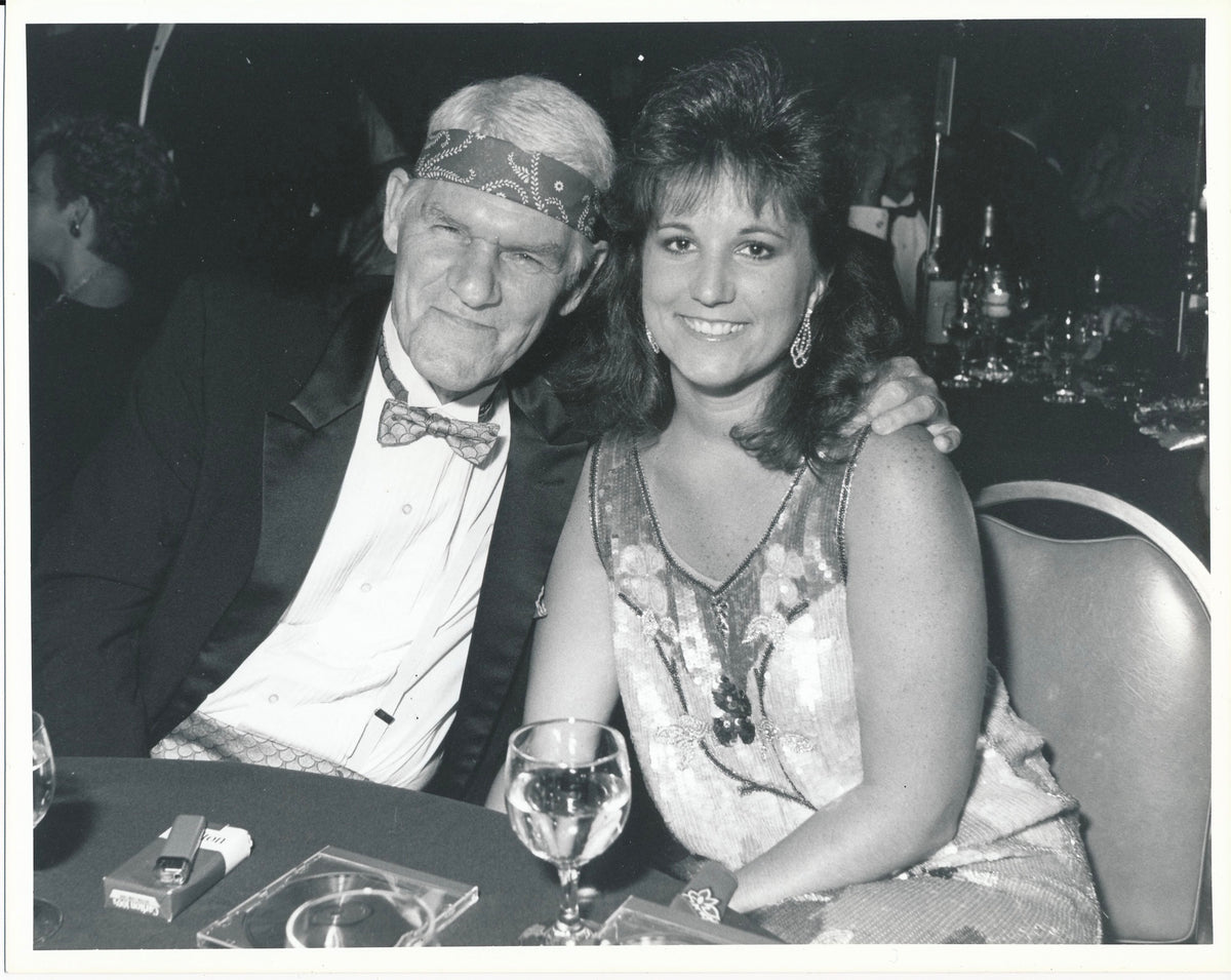 Harlan and Melanie Howard at a dinner party for Willie Nelson