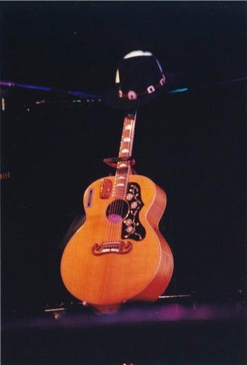 Harlan Howard's Gibson J-200 and his hat on the Ryman stage at his celebration of life